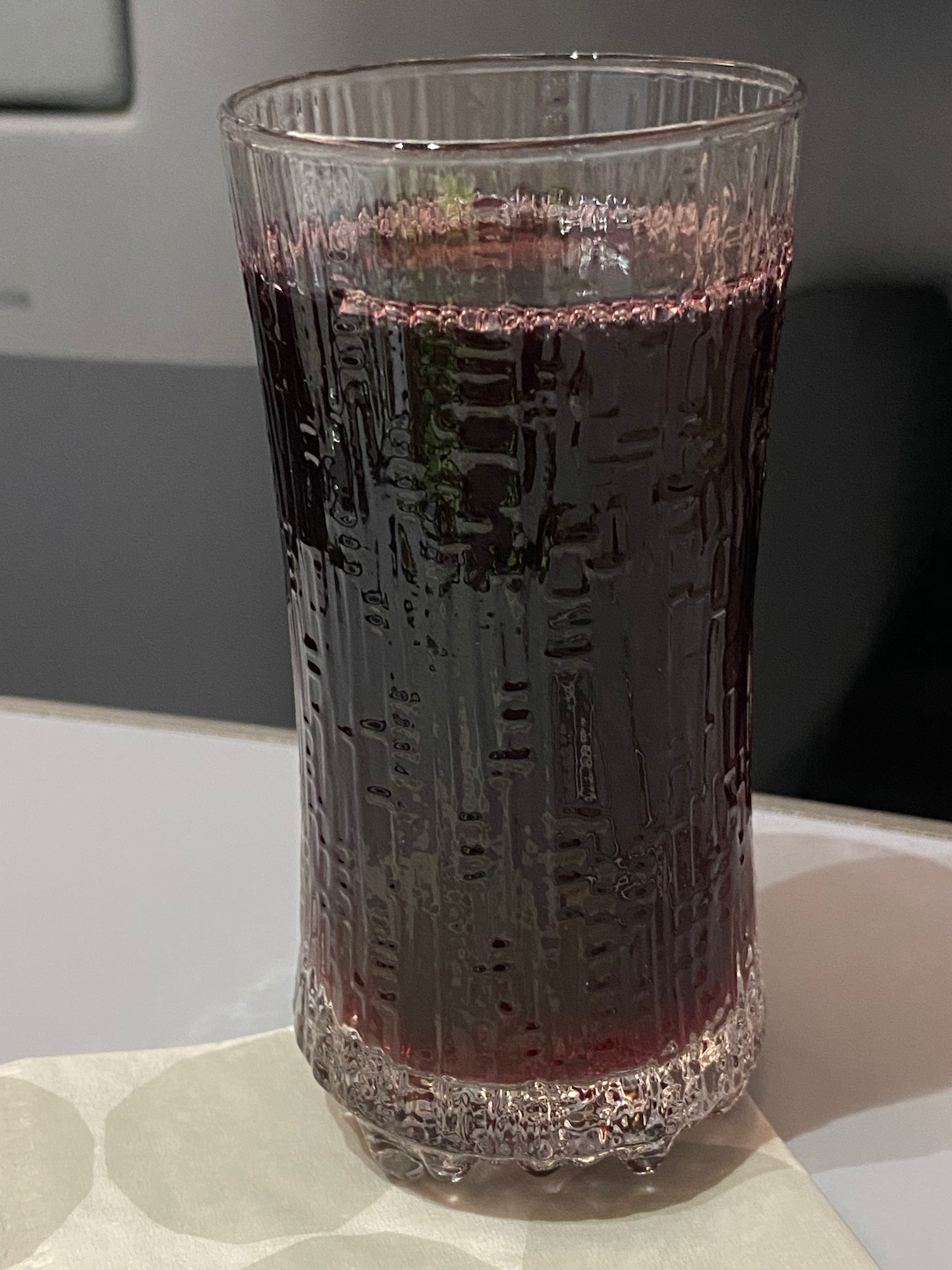 a glass of liquid on a table