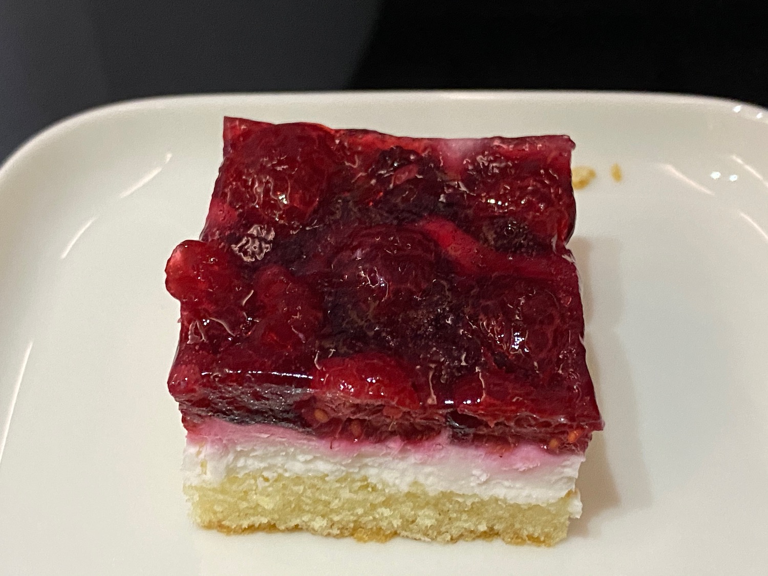 a piece of cake with jelly on top