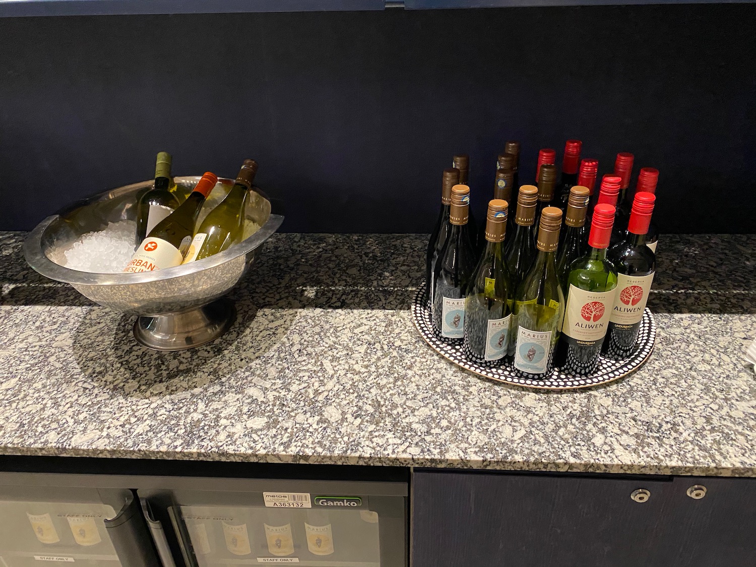 a group of bottles of wine on a counter