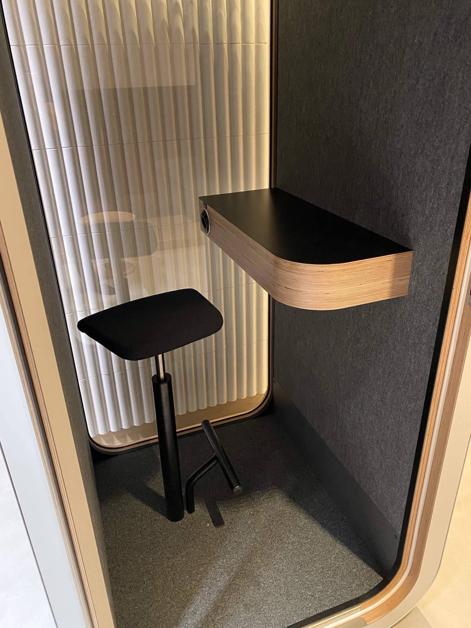 a chair and a shelf in a room