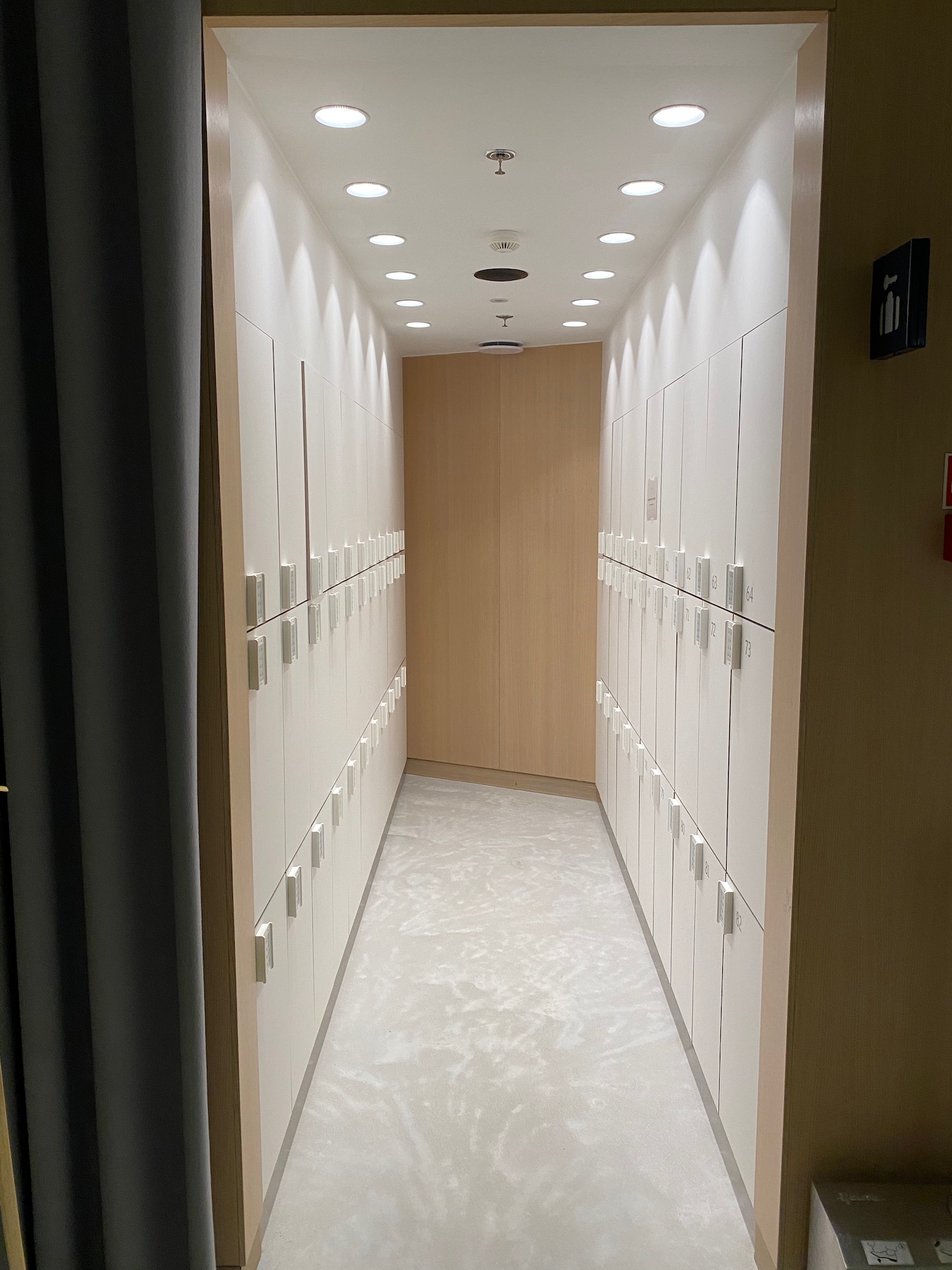 a hallway with white lockers