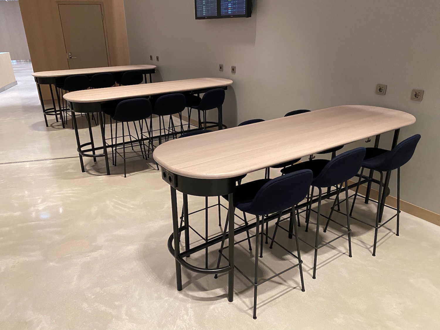 a group of tables and chairs in a room