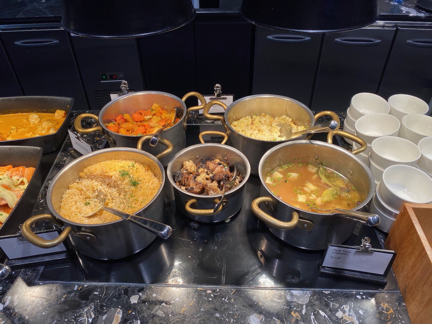a group of pots of food