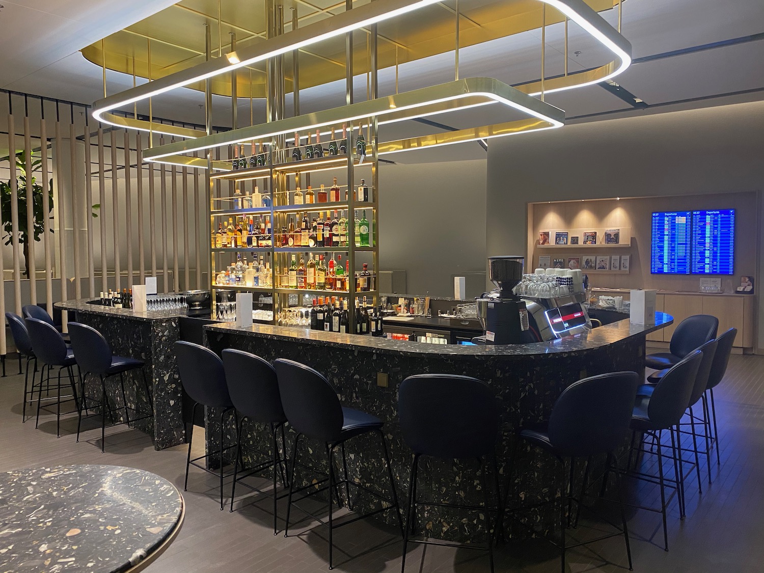 a bar with a counter and chairs