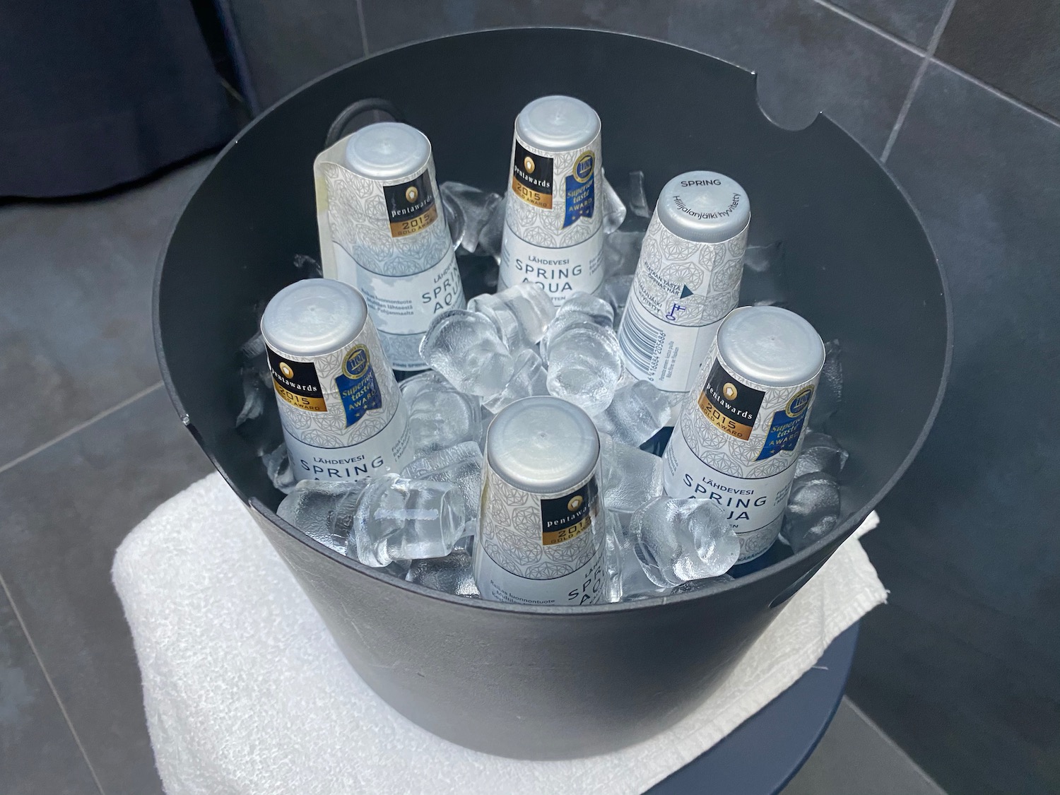 a bucket of ice and cans
