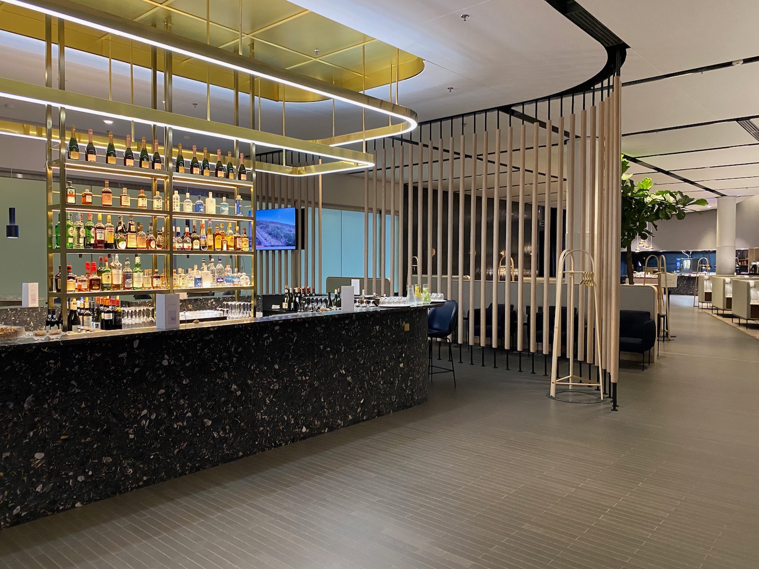 a bar with bottles of alcohol on the counter