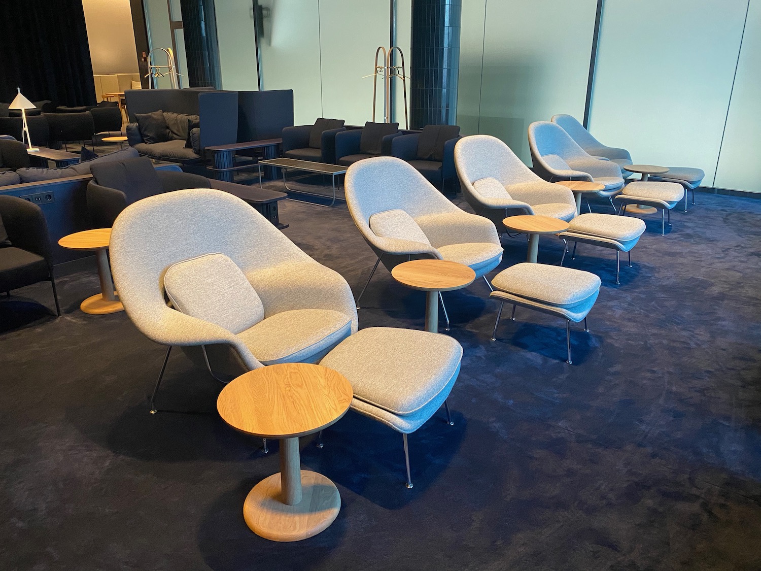 a group of chairs and tables in a room