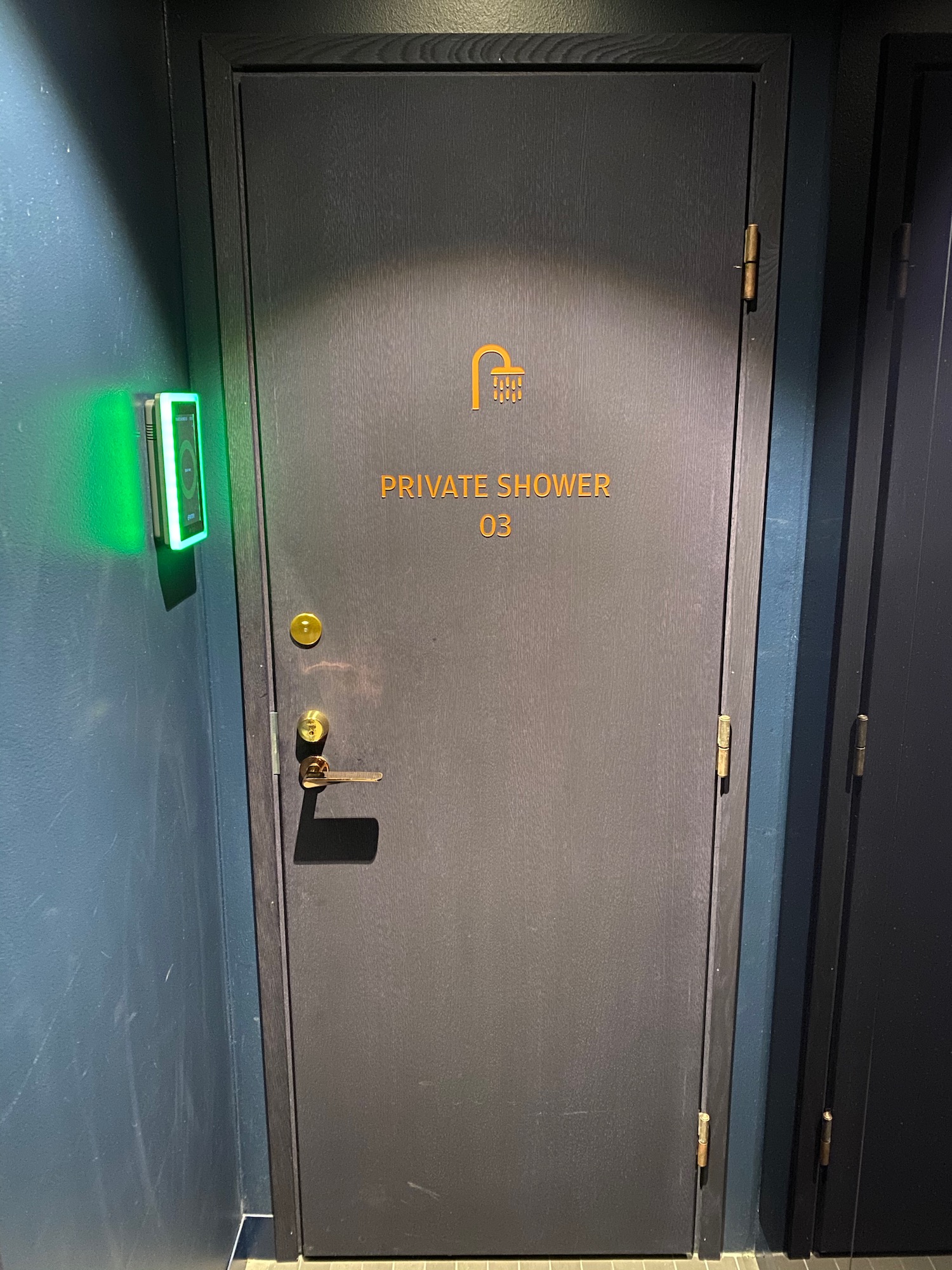 a door with a lock and a green light