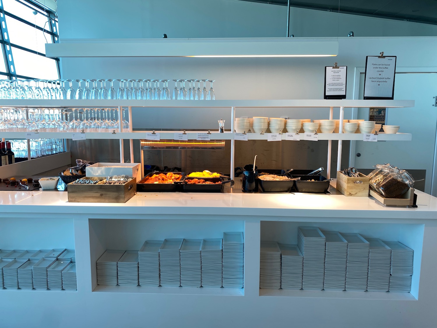 a buffet table with plates and glasses