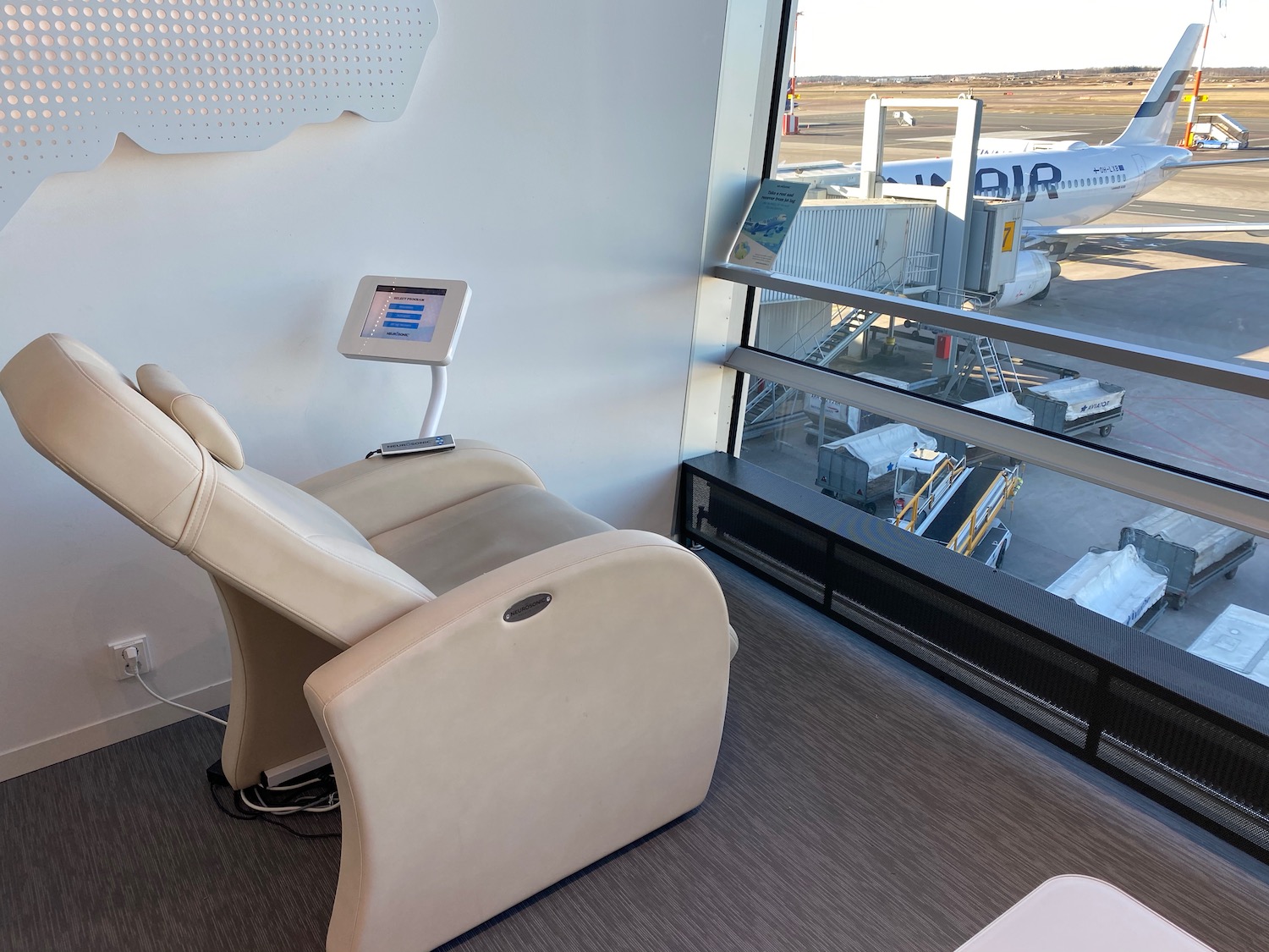 a chair in a room with a large window