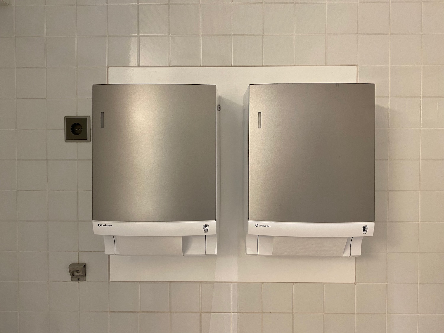 a paper towel dispensers on a wall