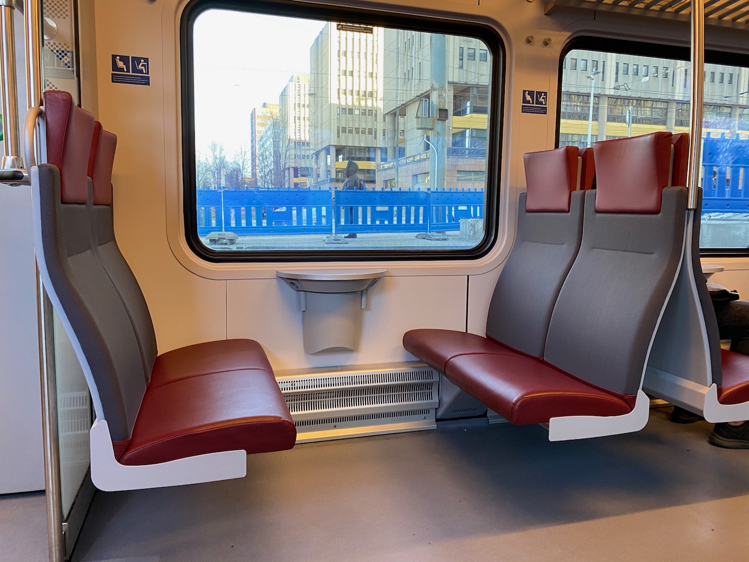 seats in a train with a window