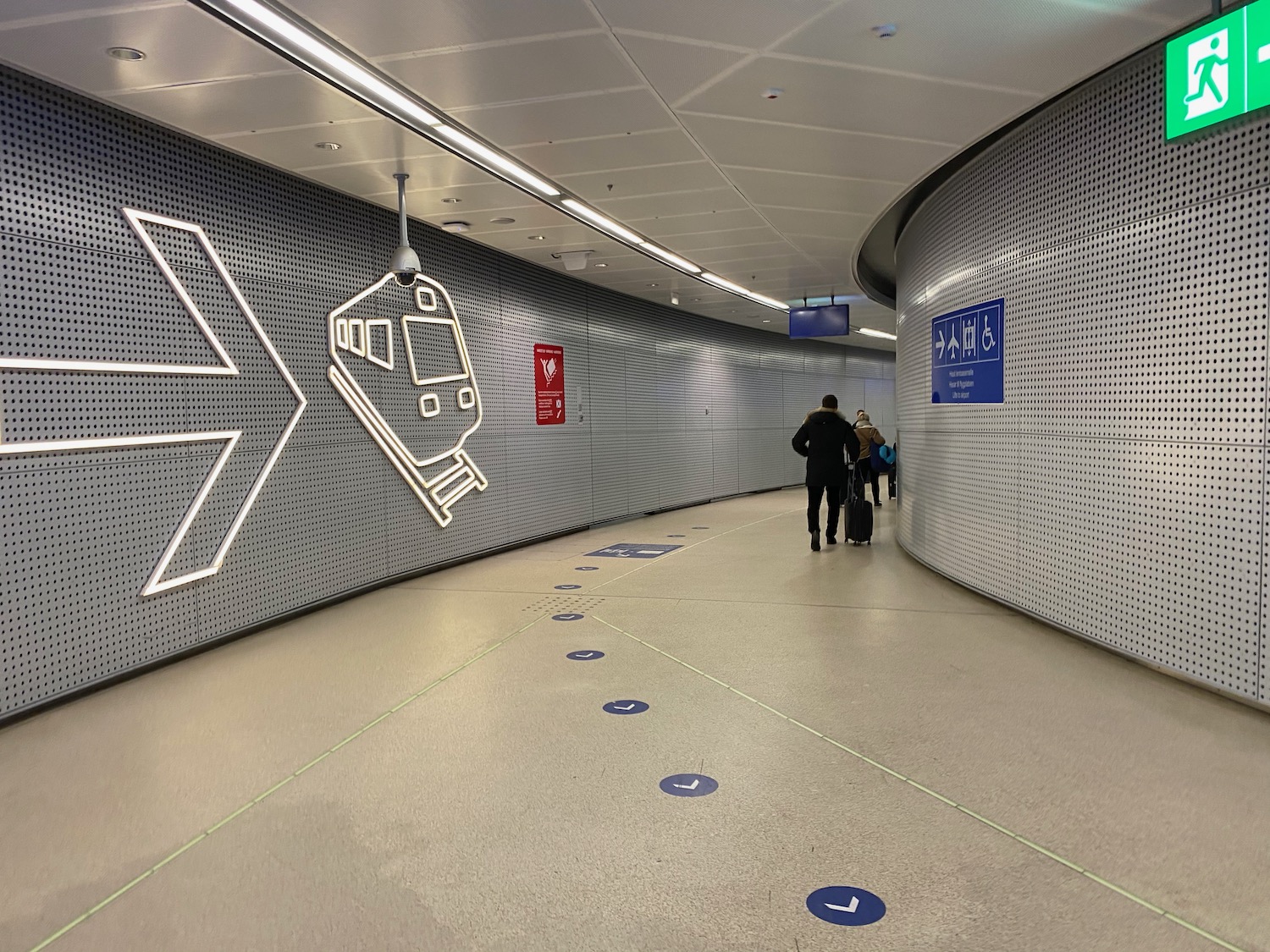 people walking in a tunnel