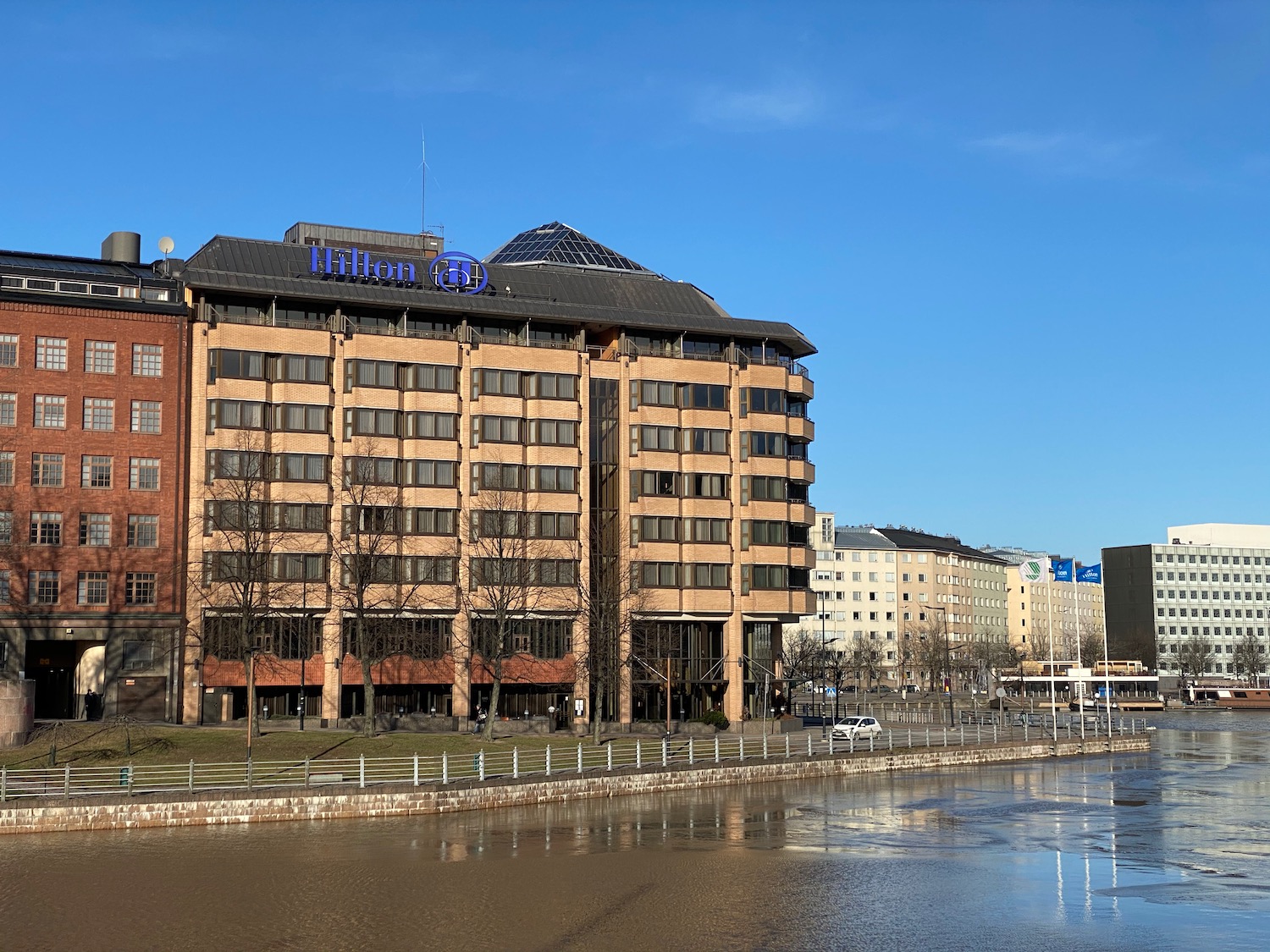 a building next to a body of water