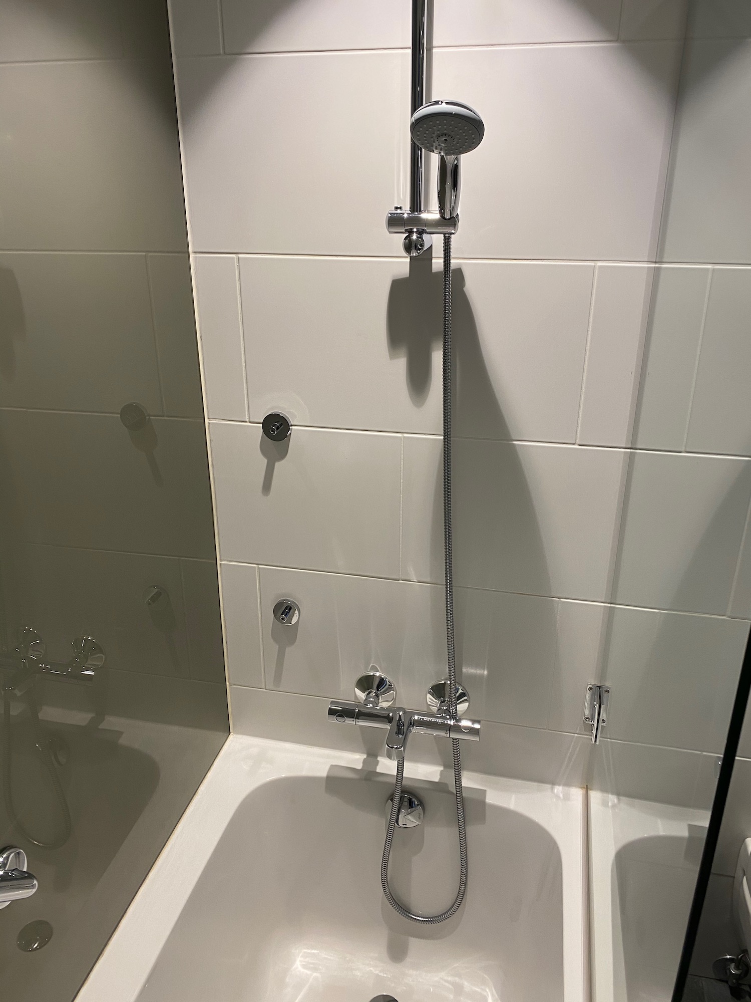 a shower head and tub in a bathroom