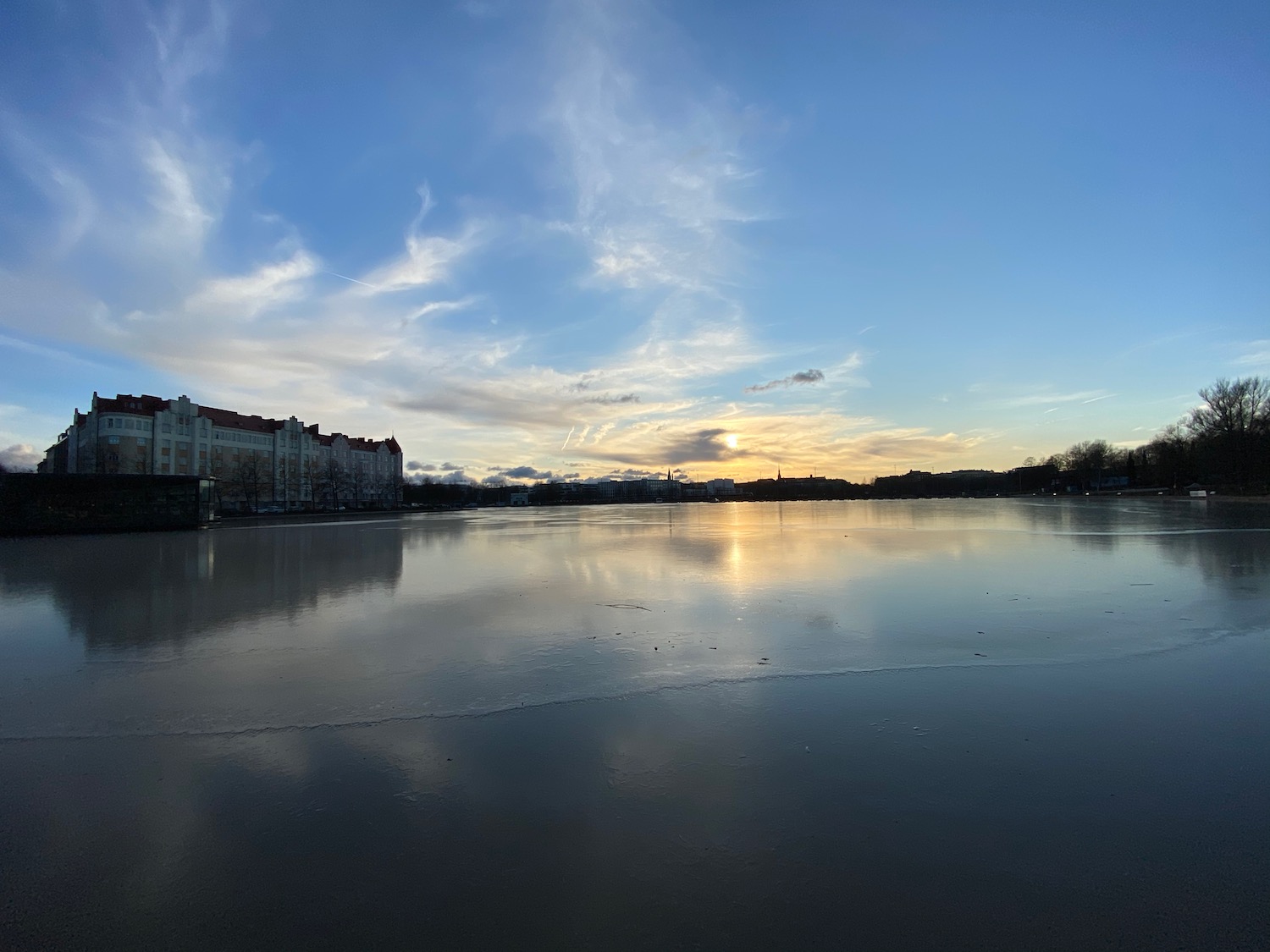 a body of water with buildings in the background