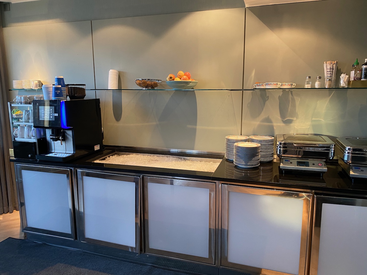 a kitchen with a counter top and a glass shelf