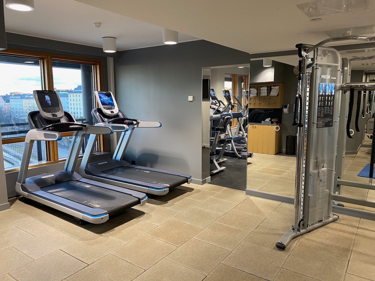 a gym with treadmills and exercise equipment