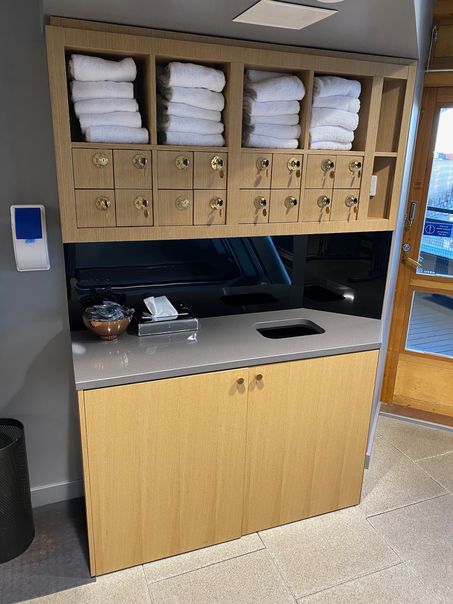 a bathroom with towels on shelves