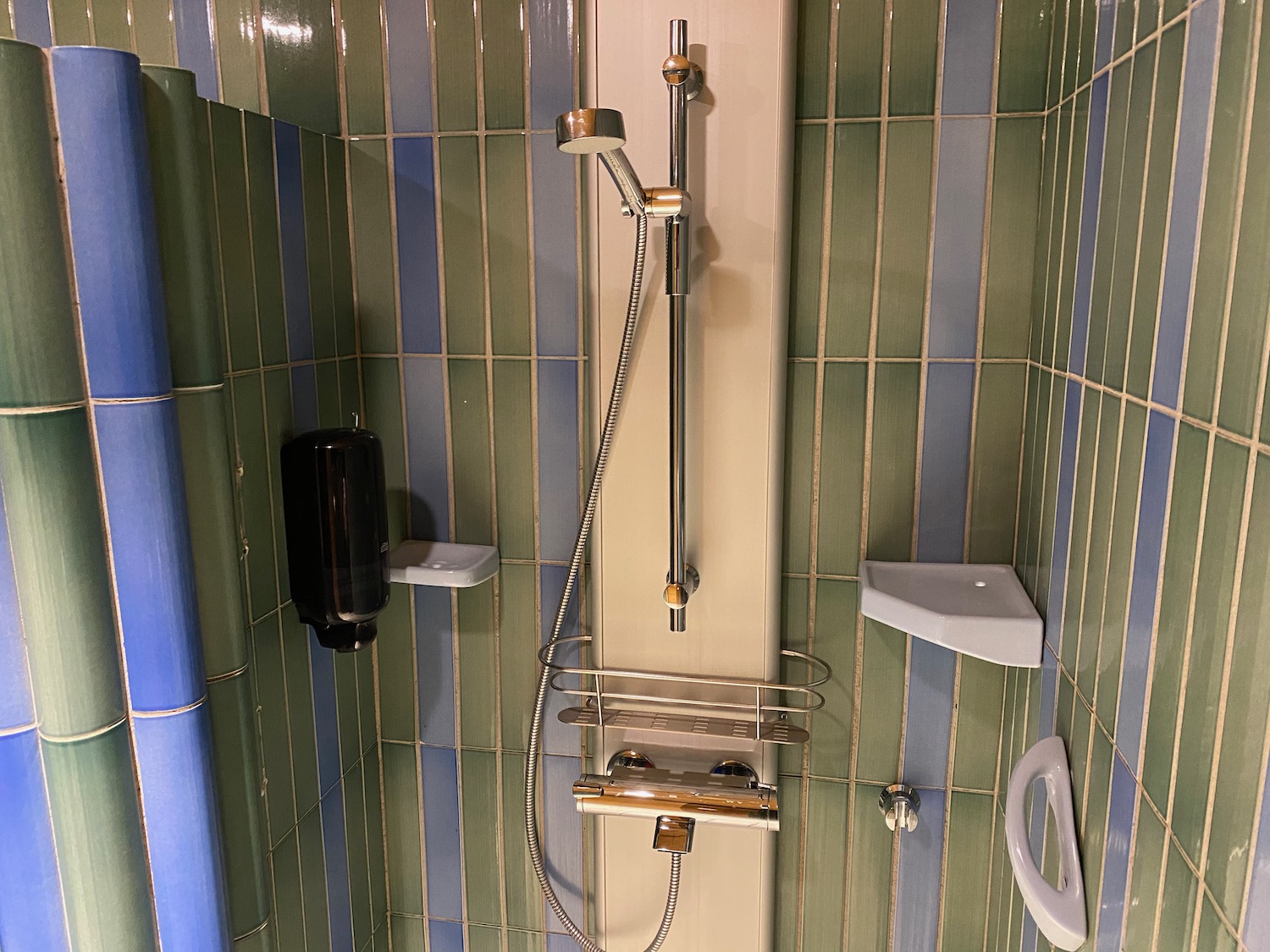 a shower head and faucet in a bathroom