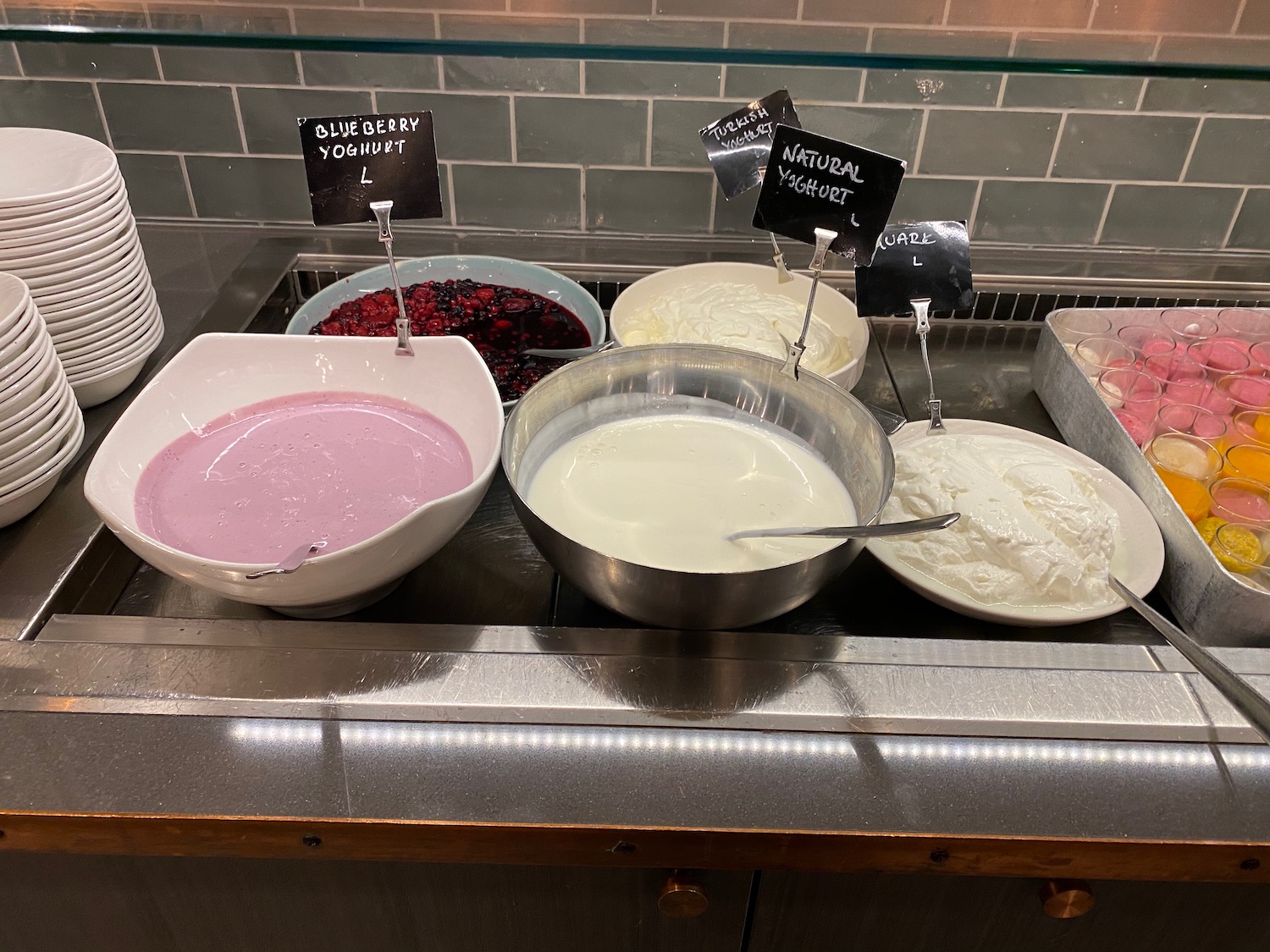 bowls of yogurt and other food items on a counter