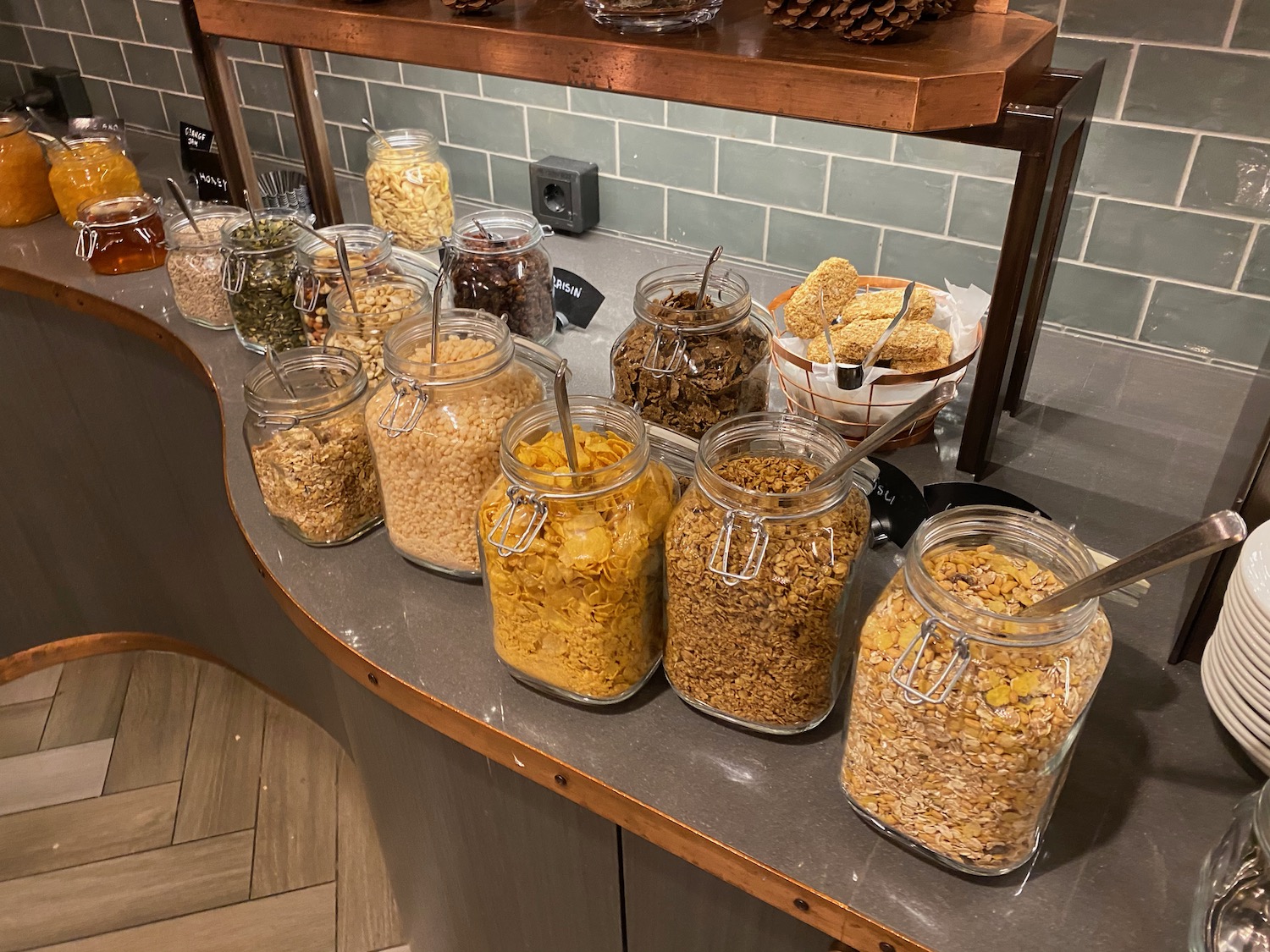 a group of glass jars of cereals and other food