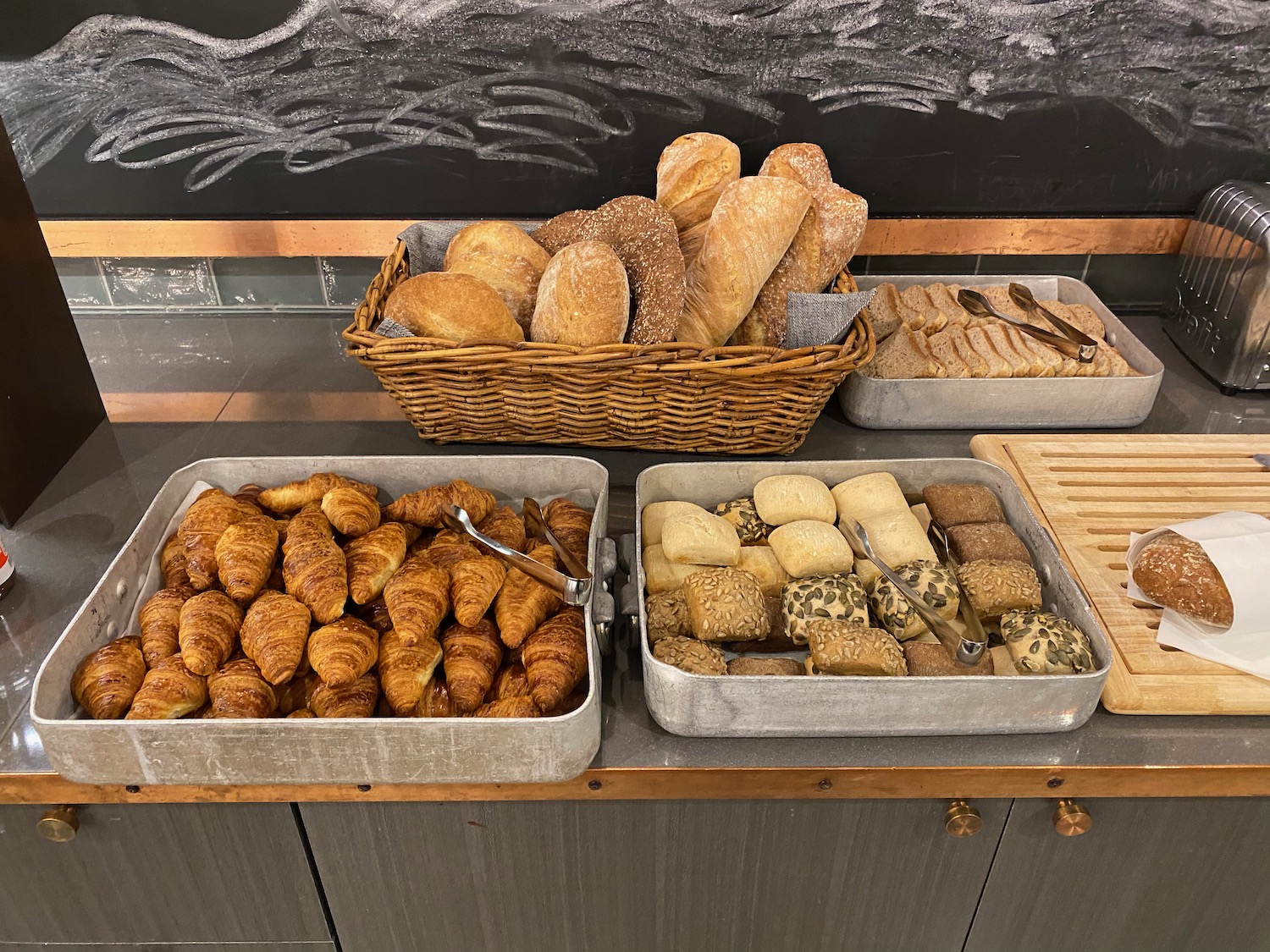 a group of bread in metal containers