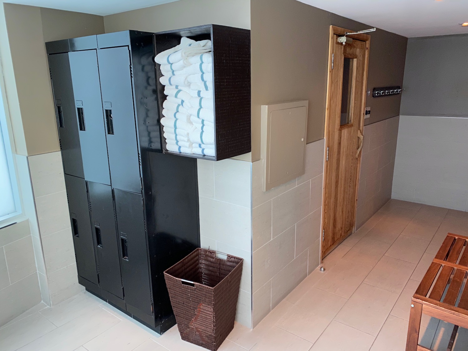 a lockers with towels stacked on top of each other