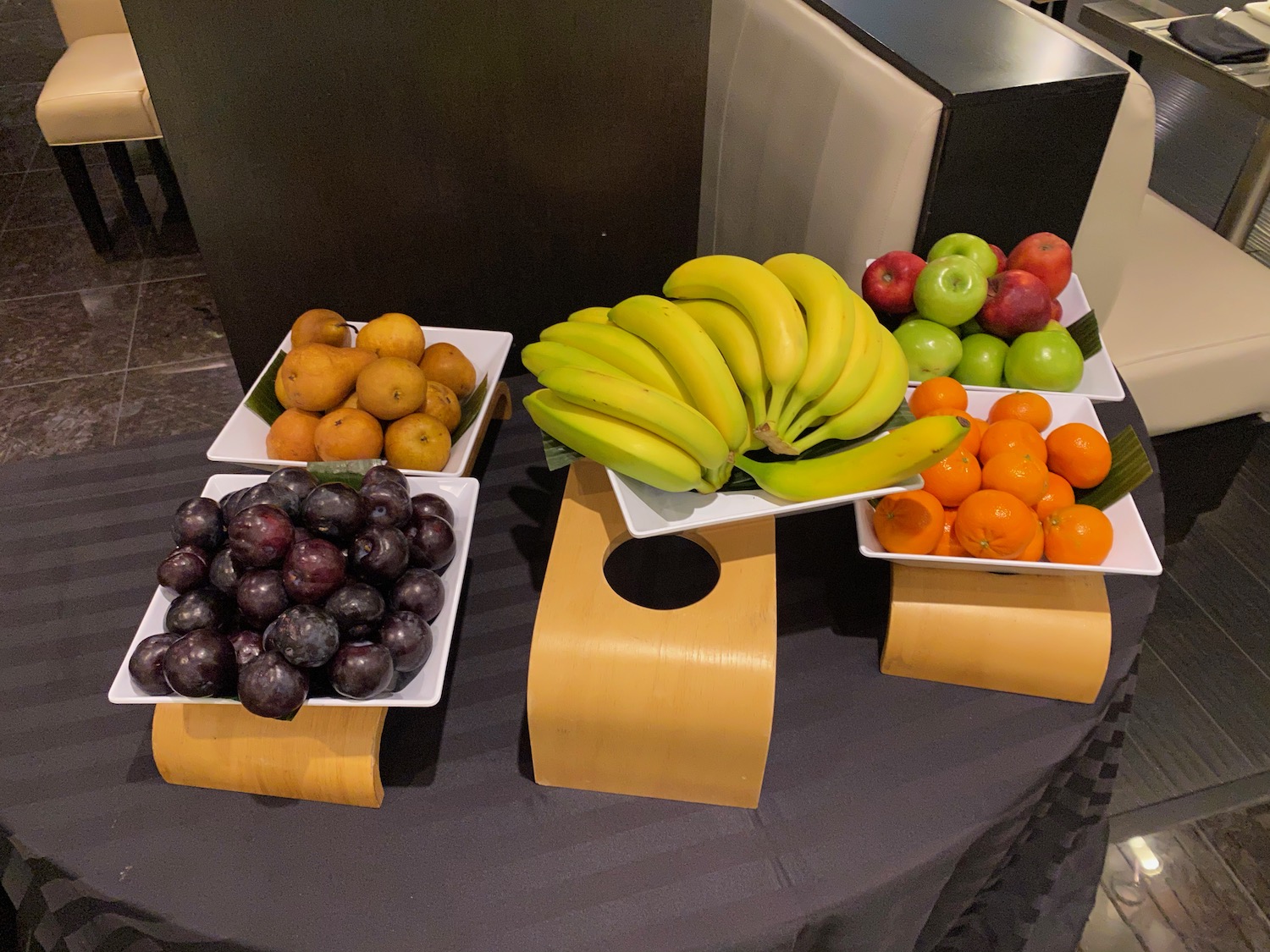 a group of bowls of fruit on a table