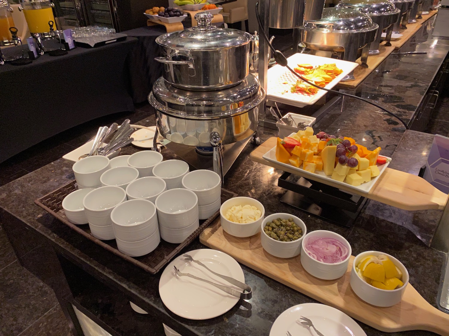 a buffet table with food and plates