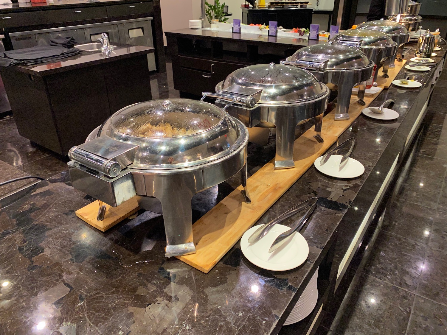 a row of silver containers on a table