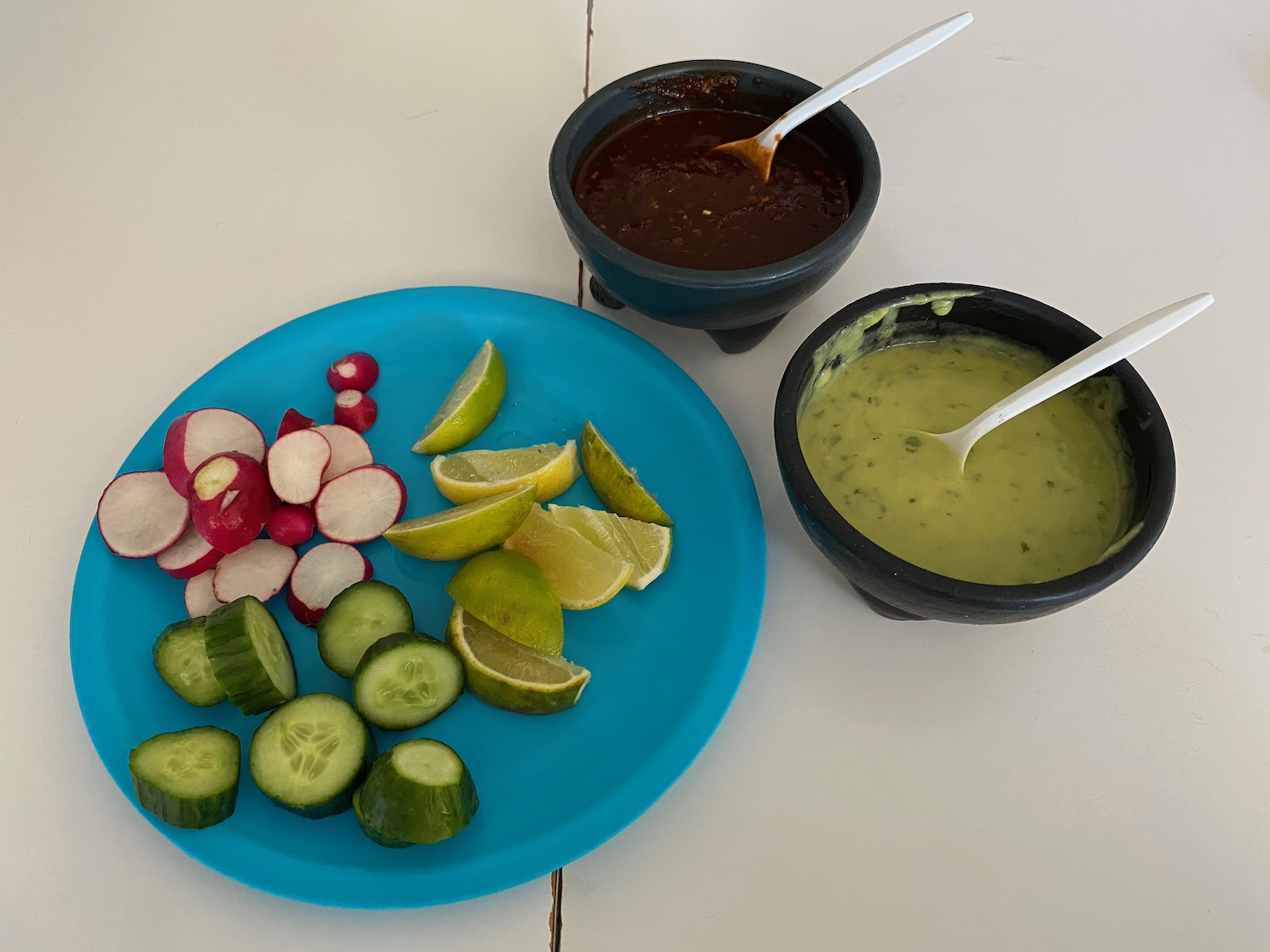 a plate of vegetables and sauces