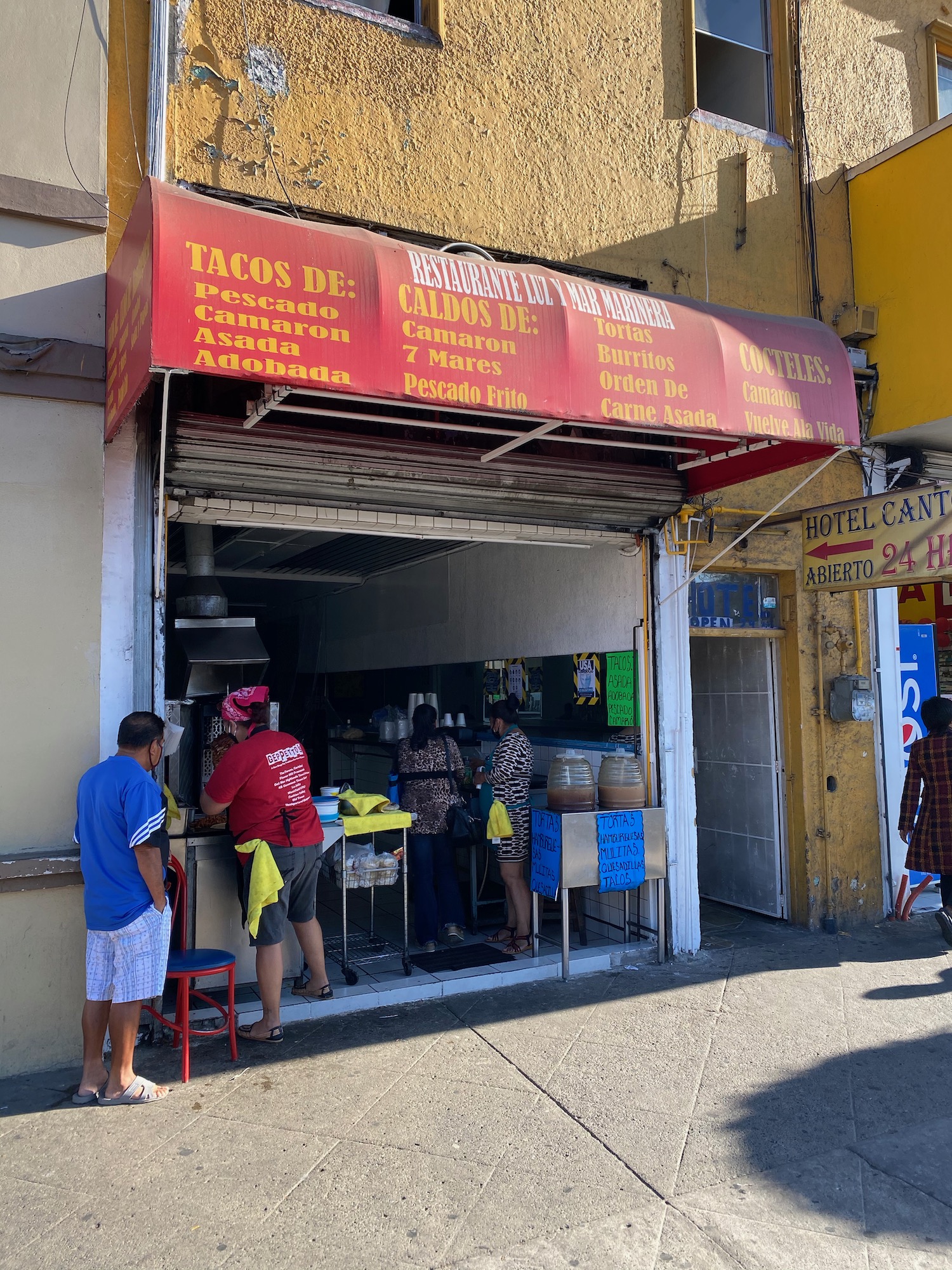 a group of people outside a store