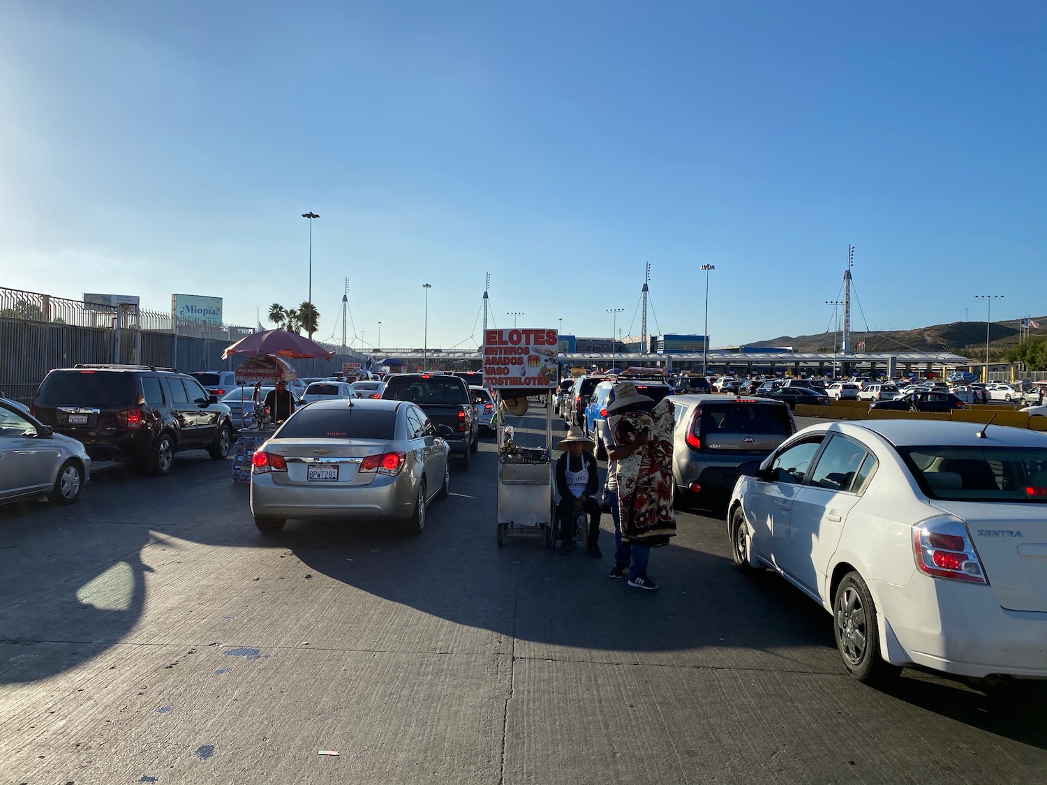 a group of people walking in a parking lot