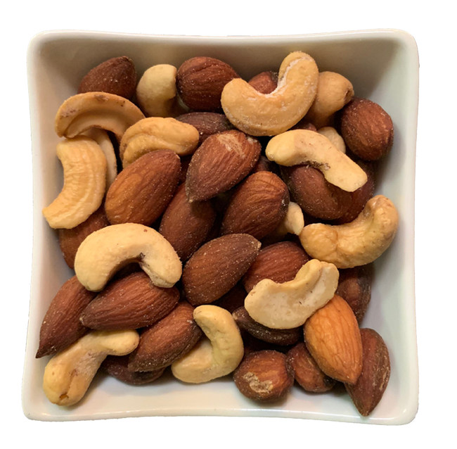 a bowl of nuts on a white background