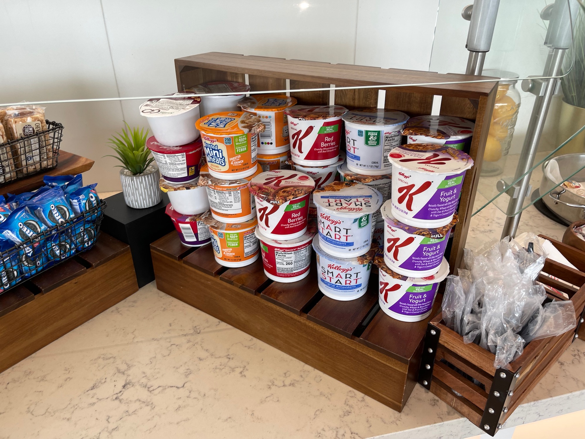 a wooden shelf with different types of yogurt
