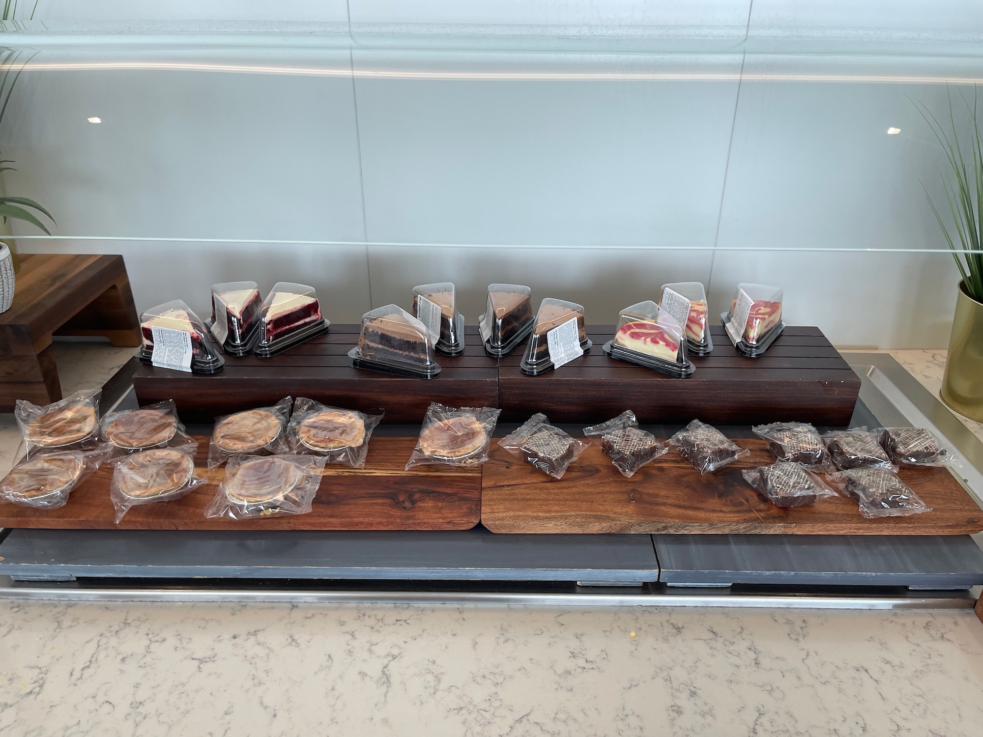 a display of cakes and desserts