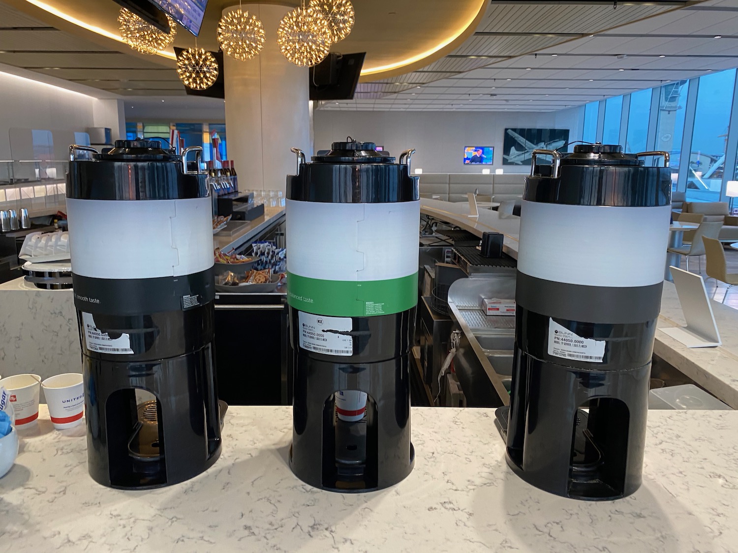 a group of black and white containers on a counter