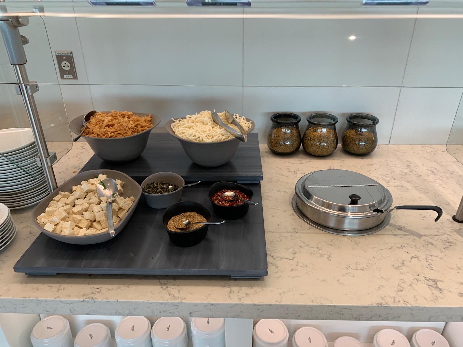 a counter with bowls of food on it