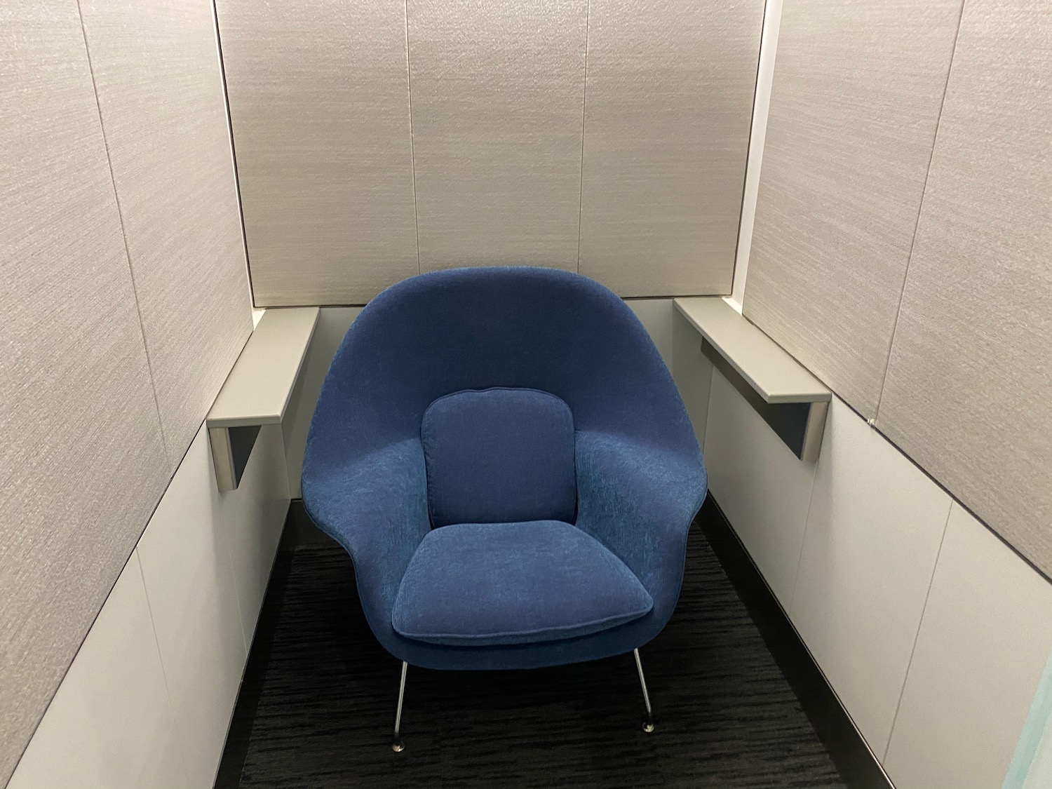 a blue chair in a room