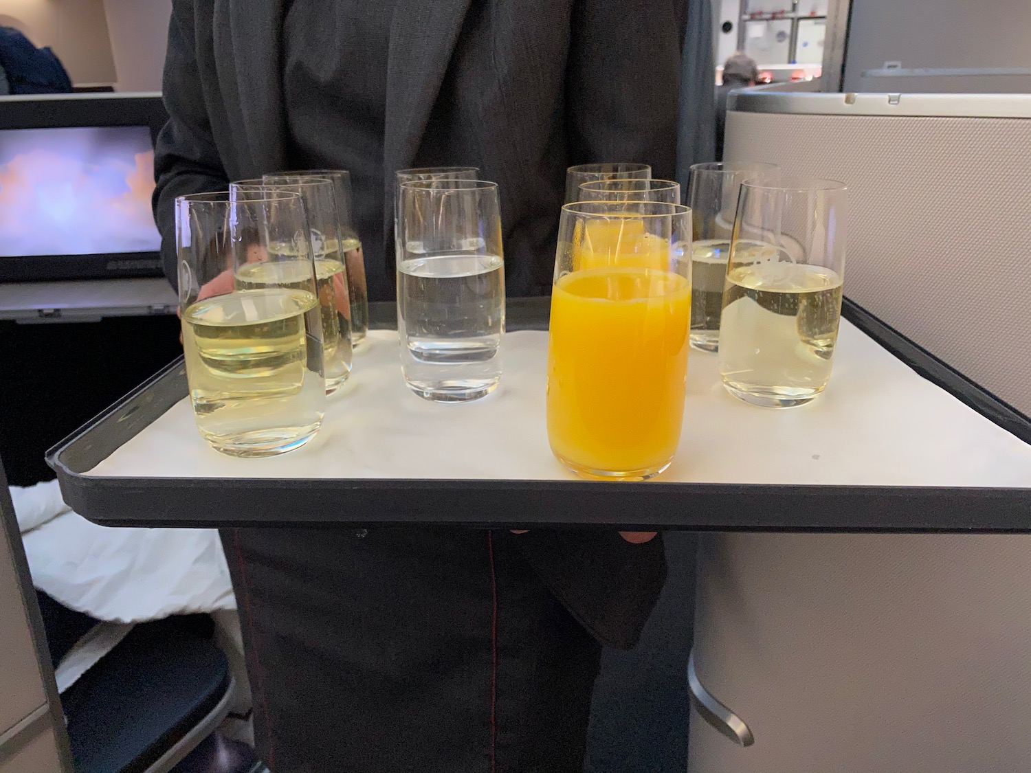 a tray of glasses filled with liquid