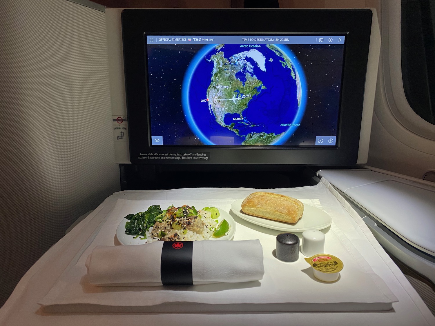 a tv screen on a table with food on it