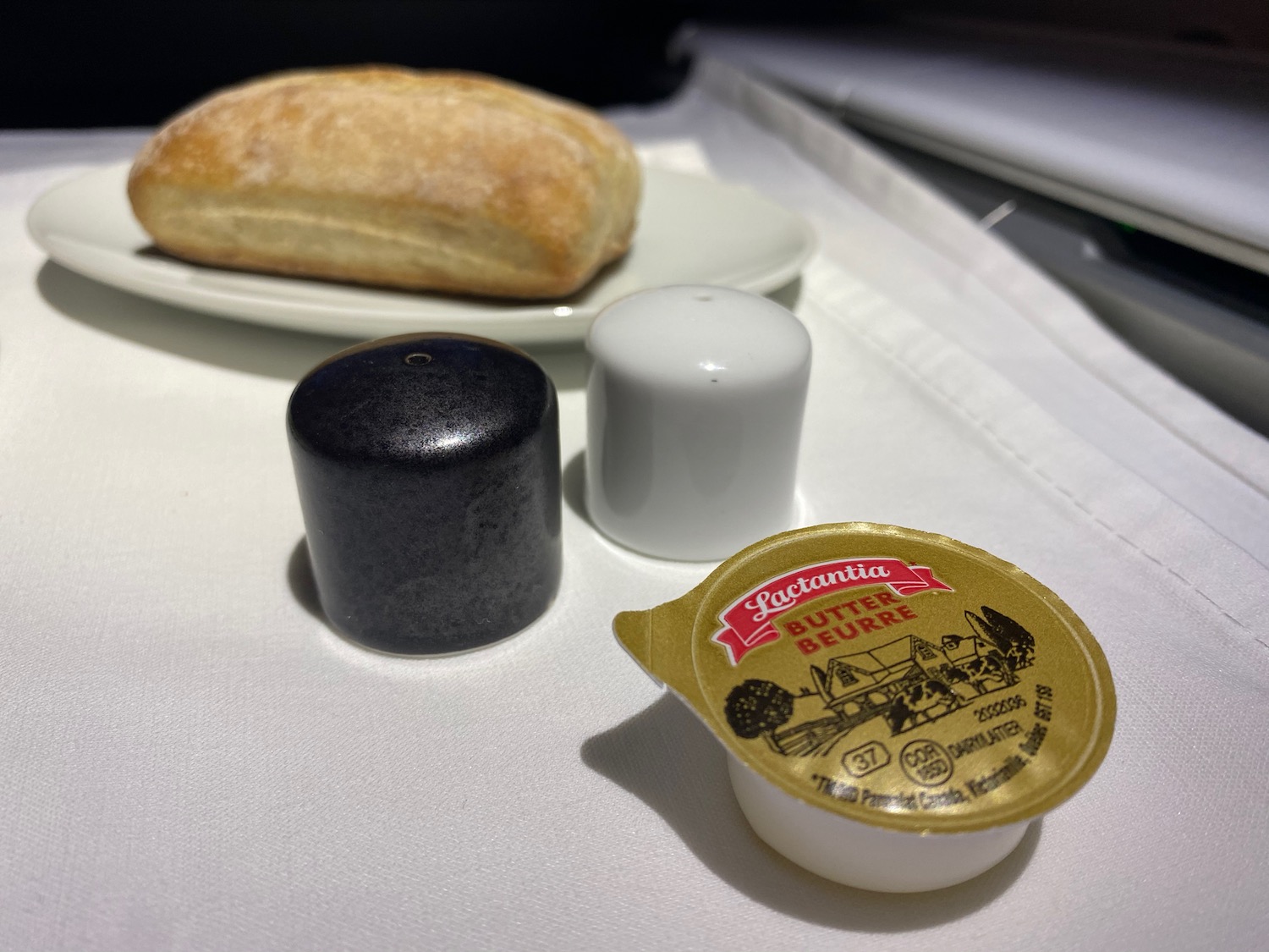 a bread and salt shakers on a table