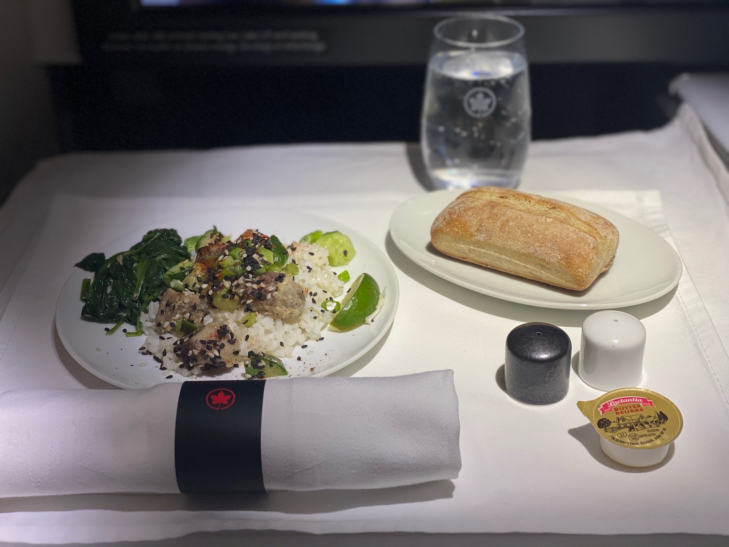 a plate of food and a napkin on a table