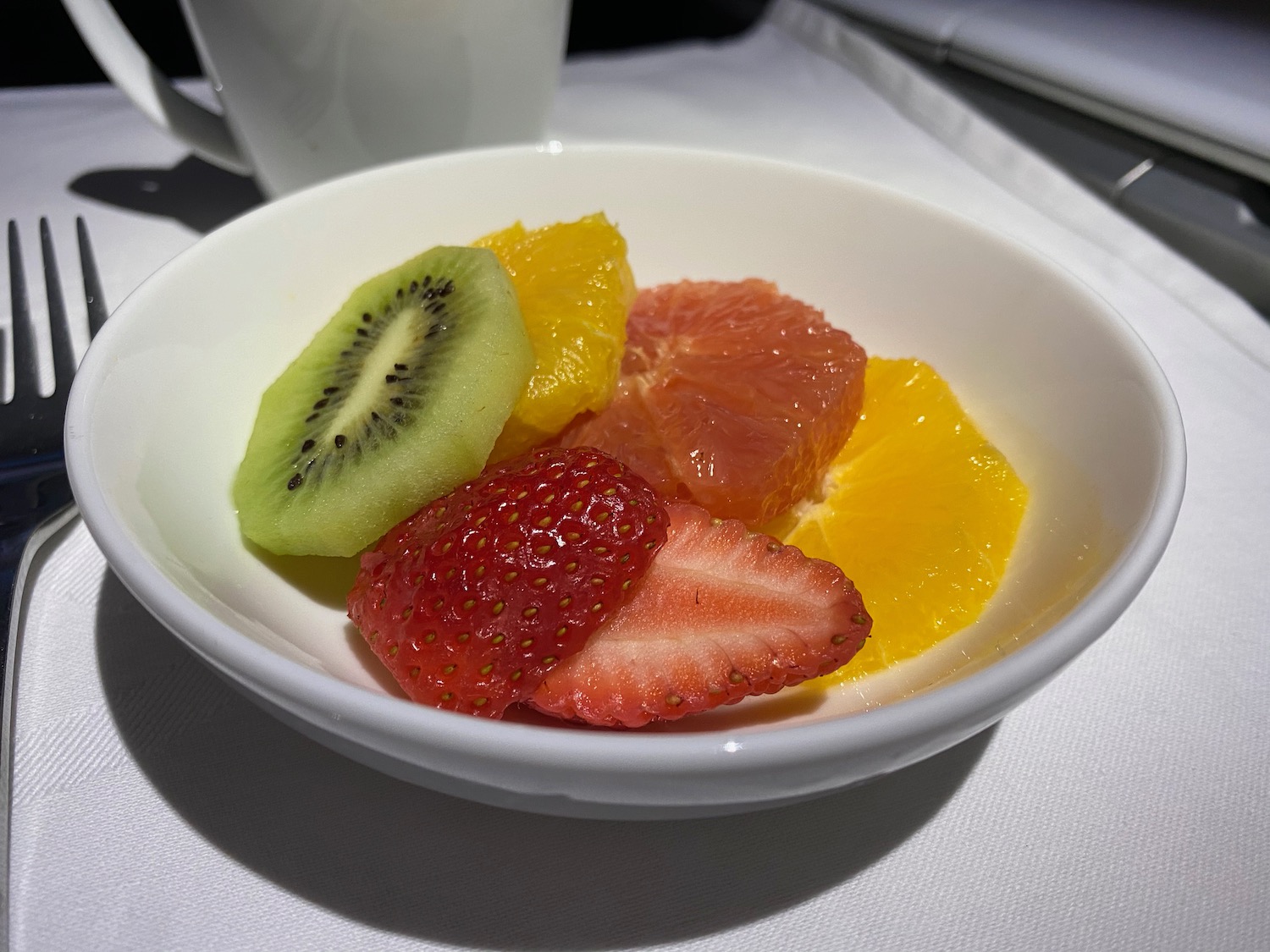 a bowl of fruit on a table