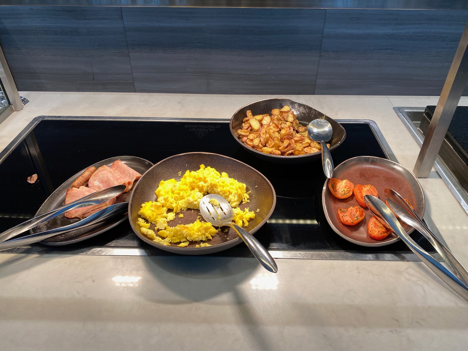 a group of bowls of food on a stove