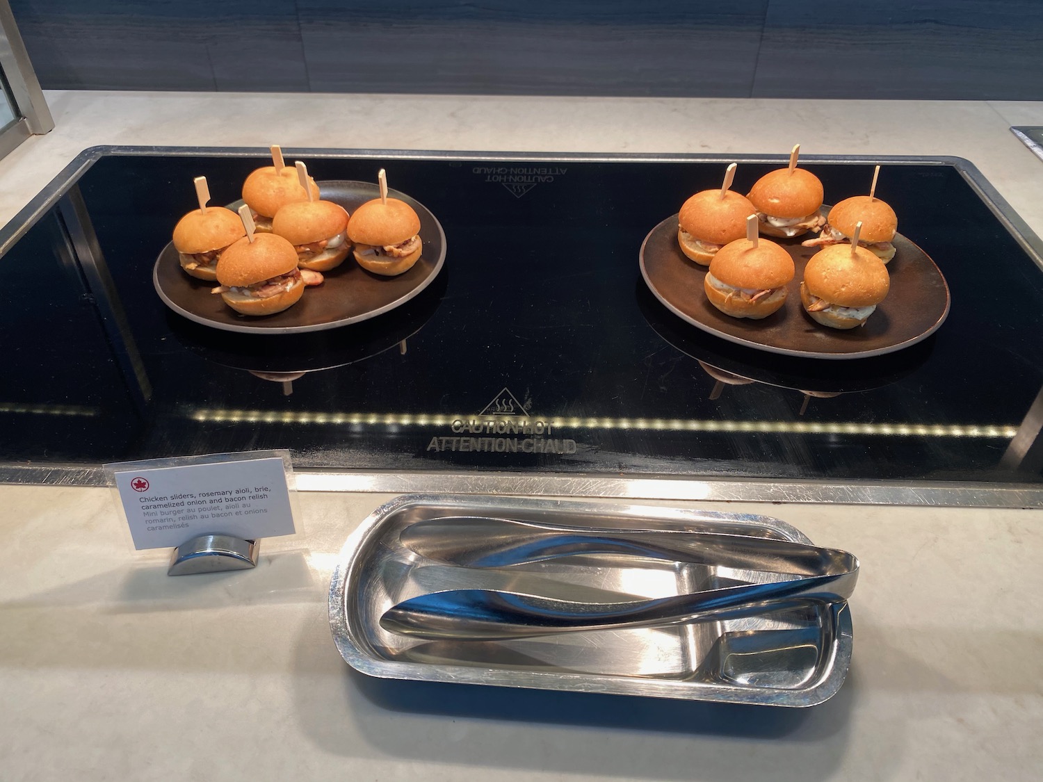 a plate of burgers on a stove