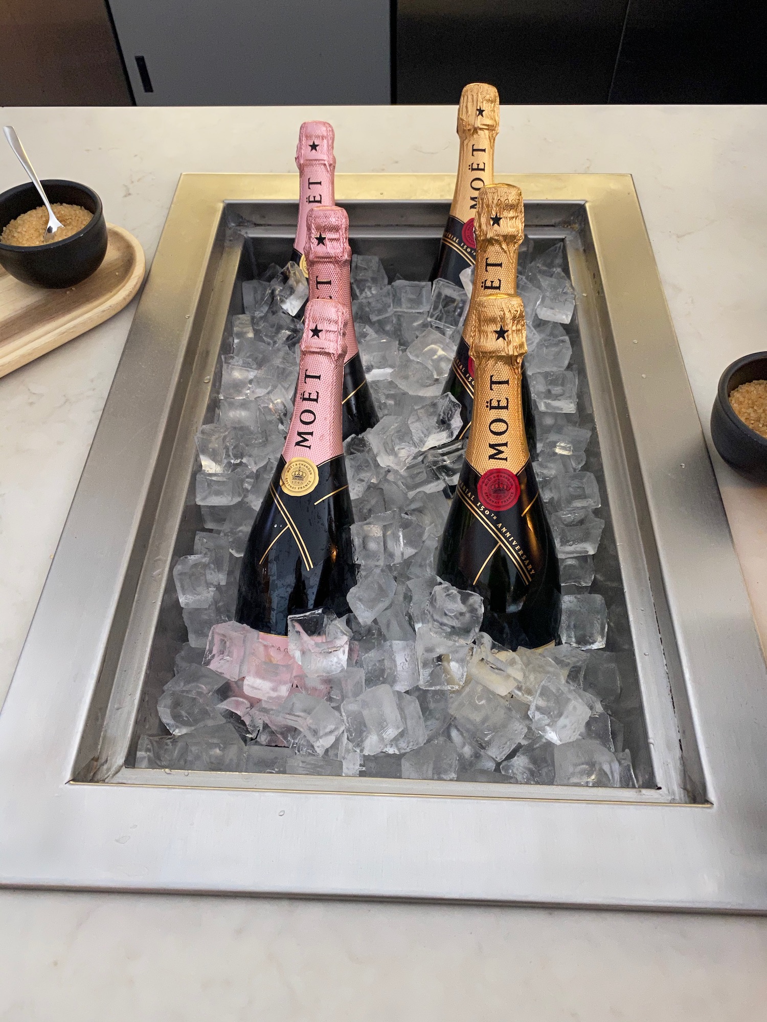 a group of champagne bottles in ice