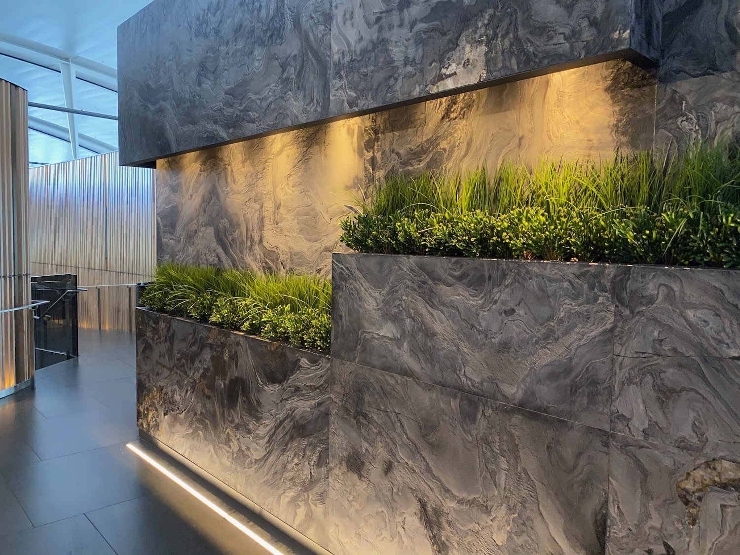 a planter with plants on a wall