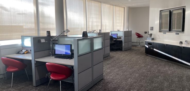 an office with cubicles and desks